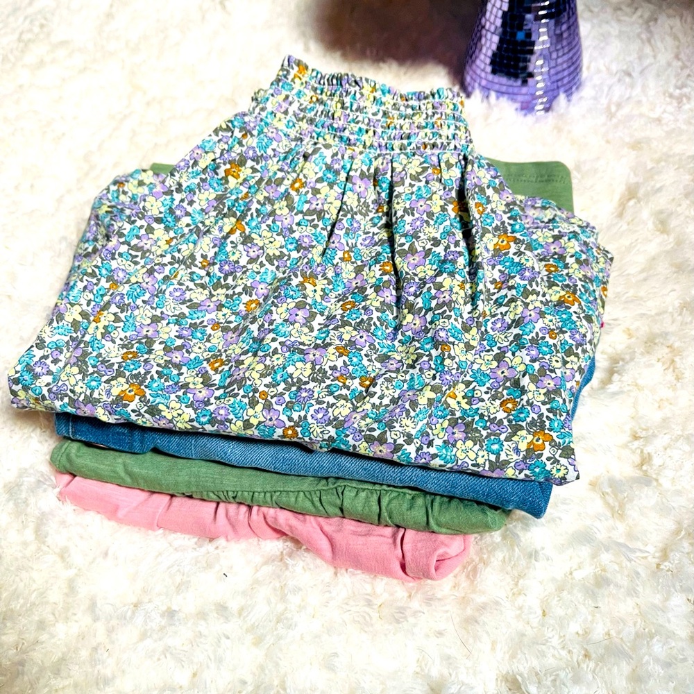Bundle of 2  girls skirts size 10 and 12 and 2 girls tops size 12.